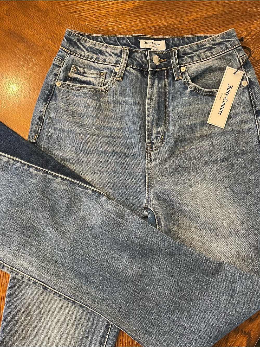 Juicy Couture High waisted two toned flare jeans medium and dark Wash size 27
